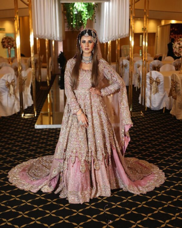 light pink bridal gown with long trail