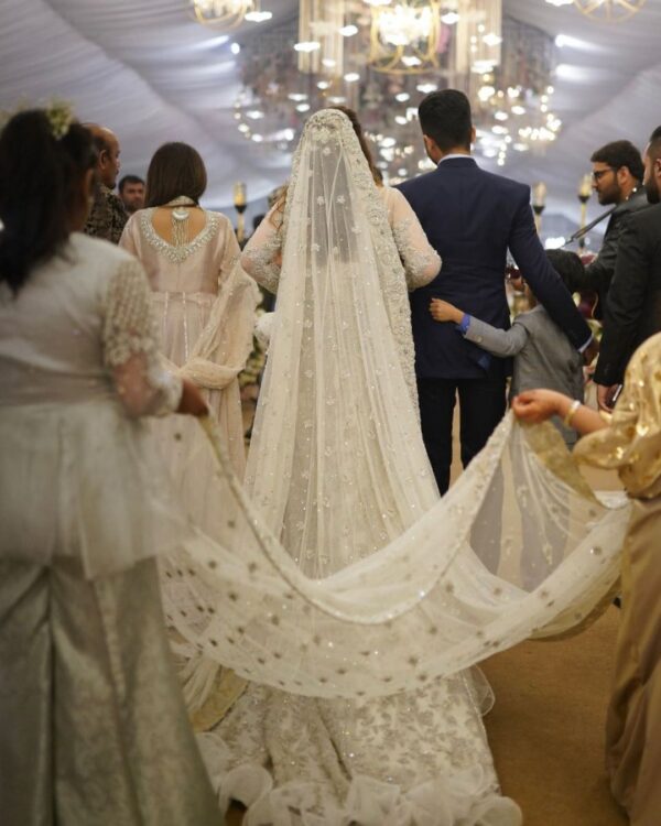 white long trial gown with white embroidery