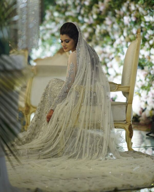 White bridal long trail gown with silver embroidery