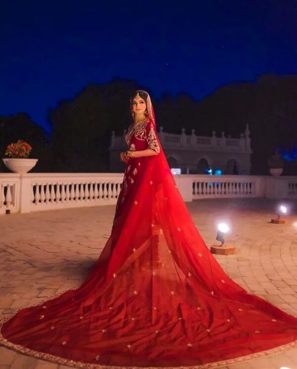 red long anarkali bridal lehenga with long trail