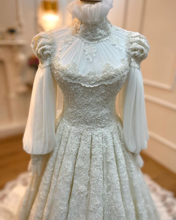 long trail wedding gown with hand work