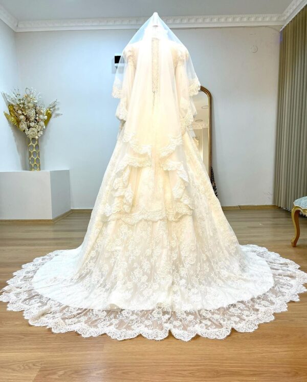 long trail wedding gown with hand work