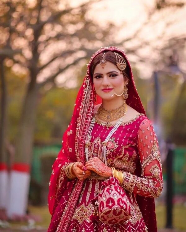 wedding rani pink bridal long gown with golden embroidery