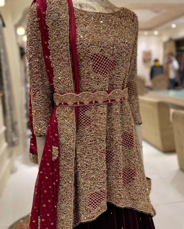 golden peplum top with maroon long trial lehenga