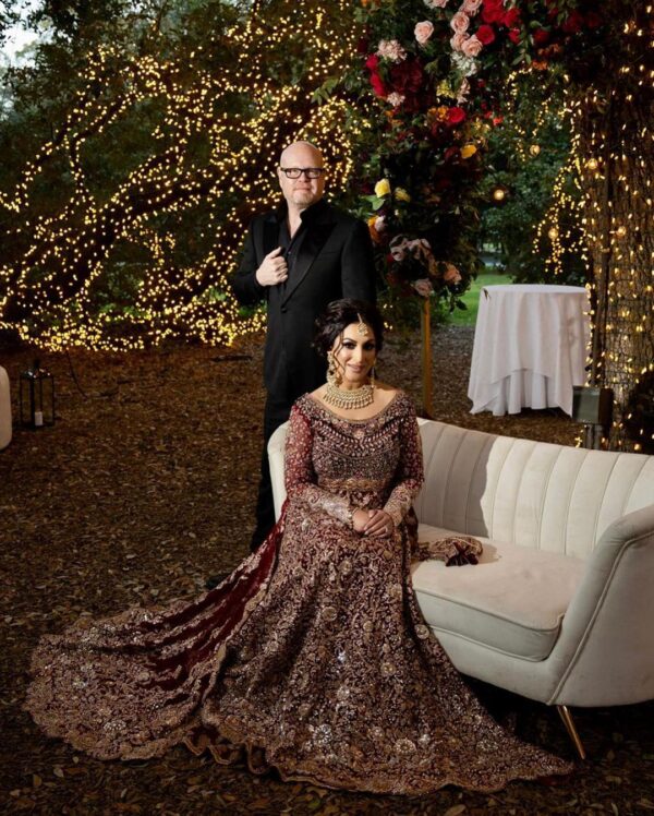 Maroon bridal gown with long trail