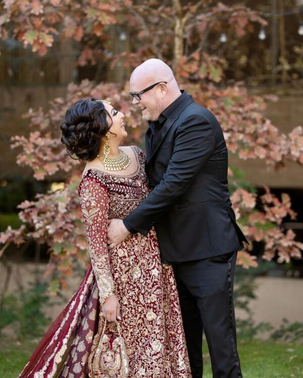 maroon bridal gown with long trail