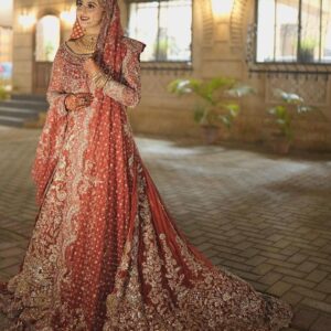 long bridal gown with golden embroidery