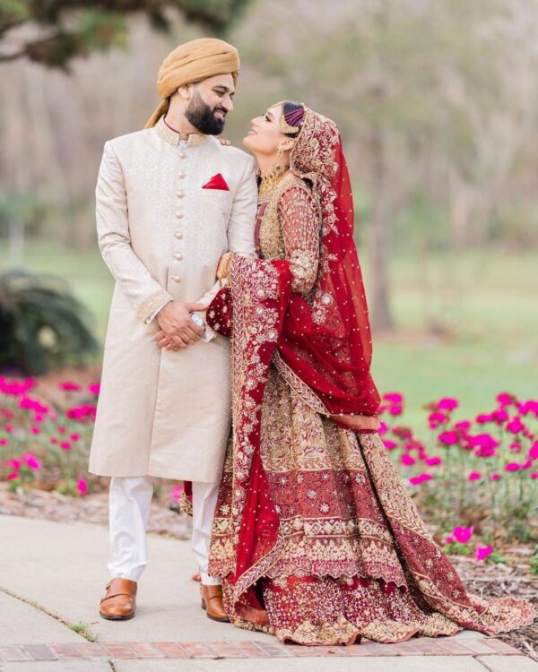 golden bridal lehenga with long trail
