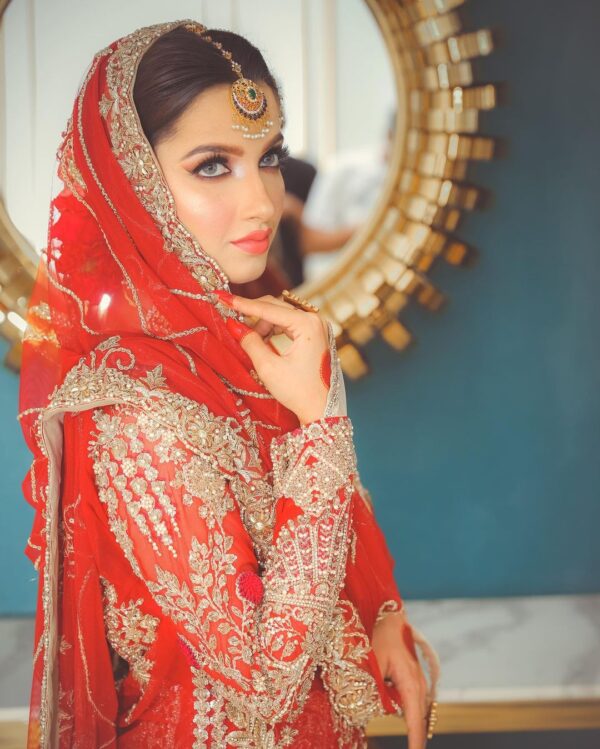 orange bridal lehenga with golden embroidery