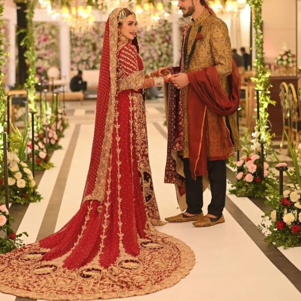 red wedding long trail gown with golden embroidery