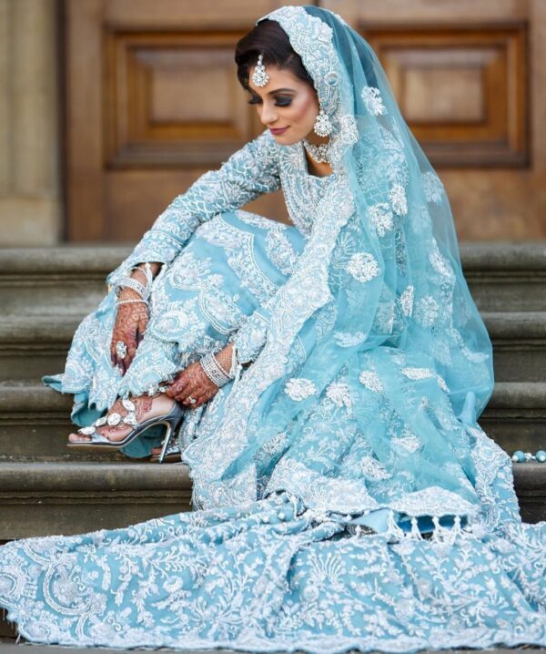 long trail wedding gown with hand work