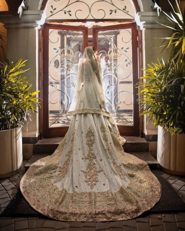 white wedding long trail gown with hand work