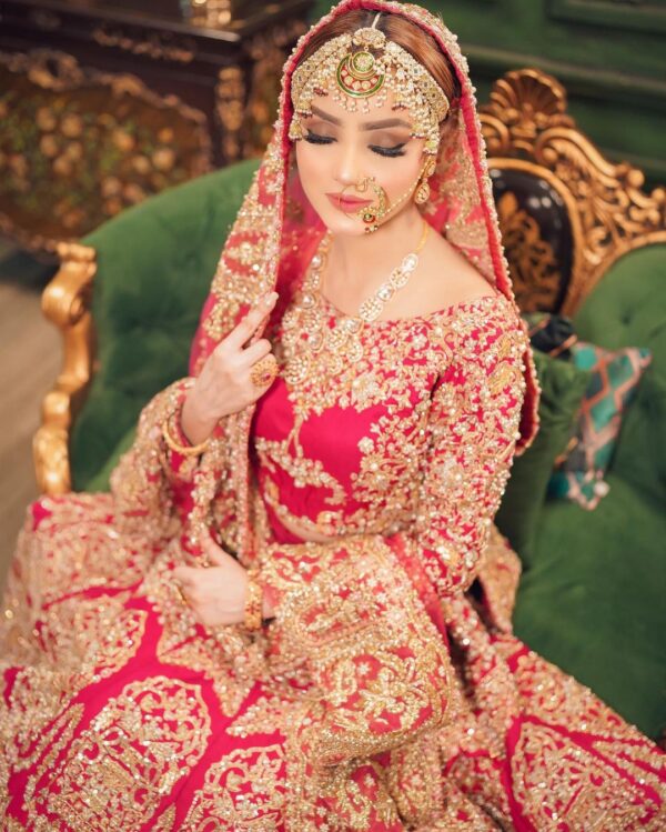 wedding rani pink lehenga with golden embroidery