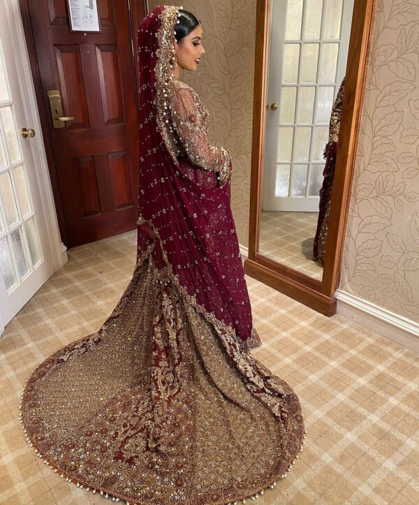 golden and purple wedding long trail gown with hand work