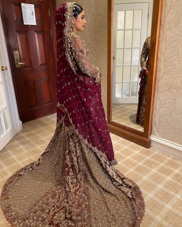 long trail wedding gown with hand work
