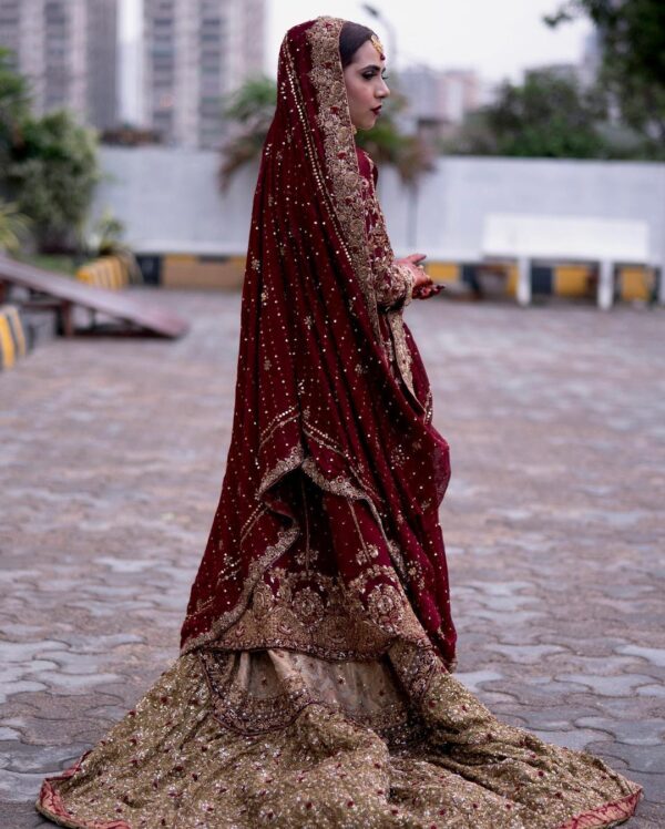 maroon with long trail lehenga with hand work