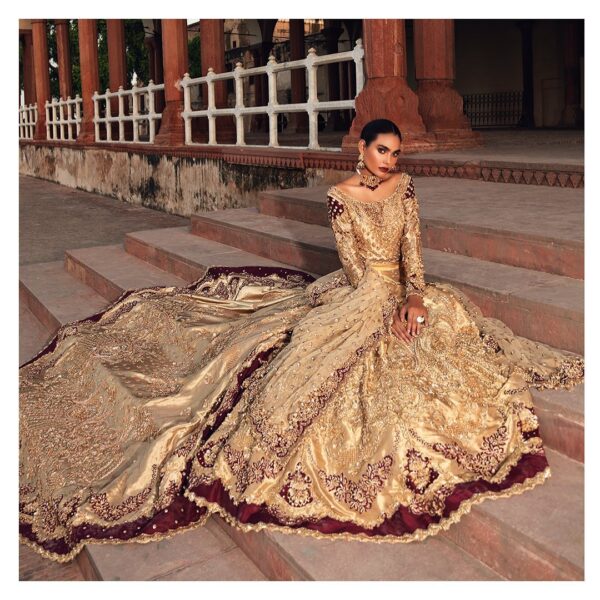 long trail wedding lehenga with golden embroidery