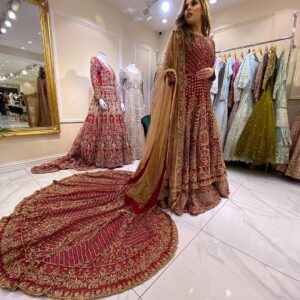long trail wedding lehenga with golden embroidery
