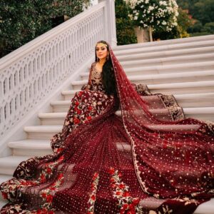 Maroon wedding gown with long trail