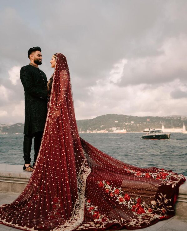 long trail wedding gown with hand work