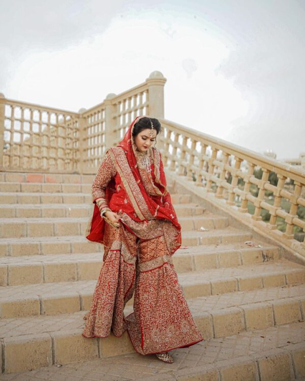 red bridal garara with golden embroidery