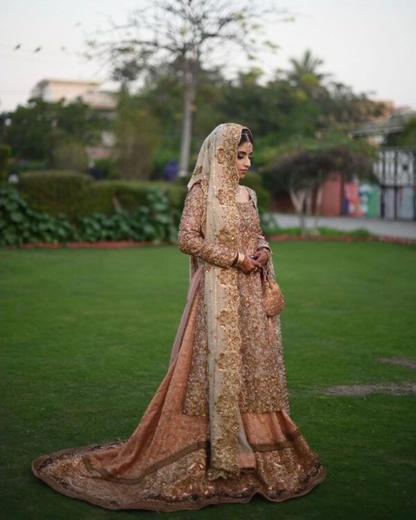 Off white embroidered kameez with pink lehenga