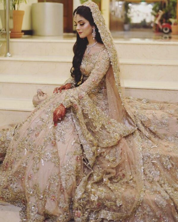 long trail wedding gown with hand work