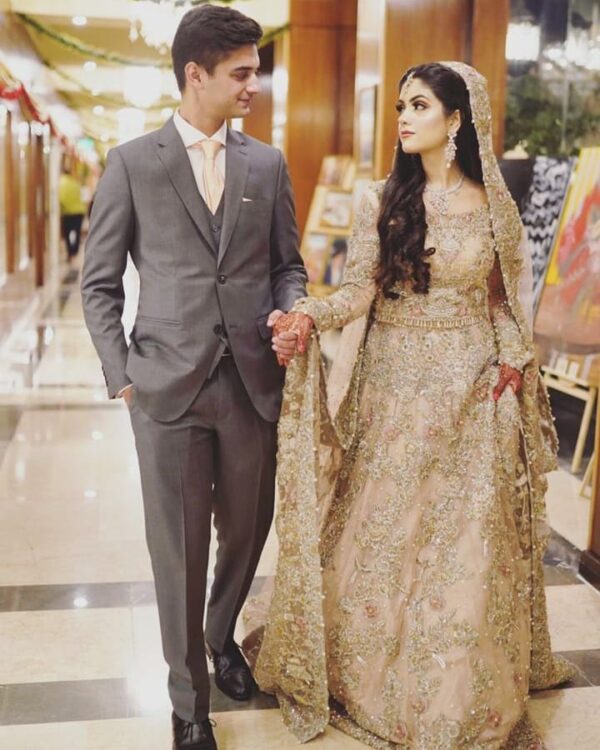 long trail wedding gown with hand work