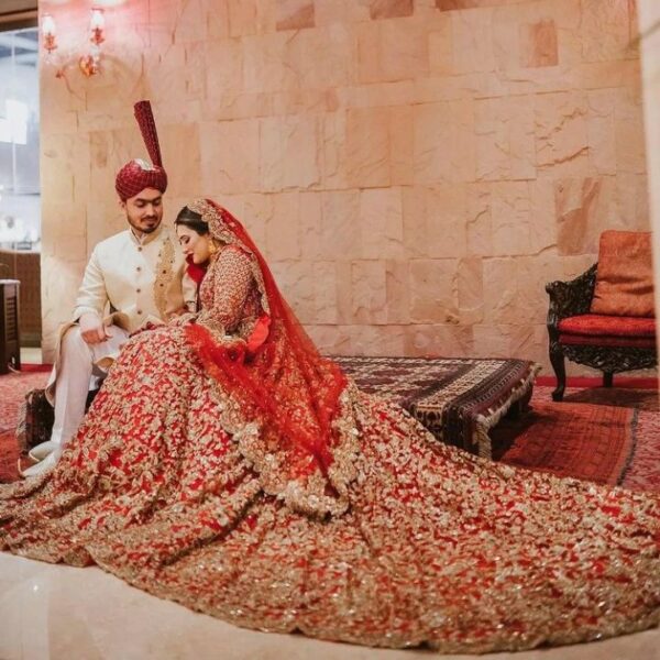 wedding long trail lehenga with handwork