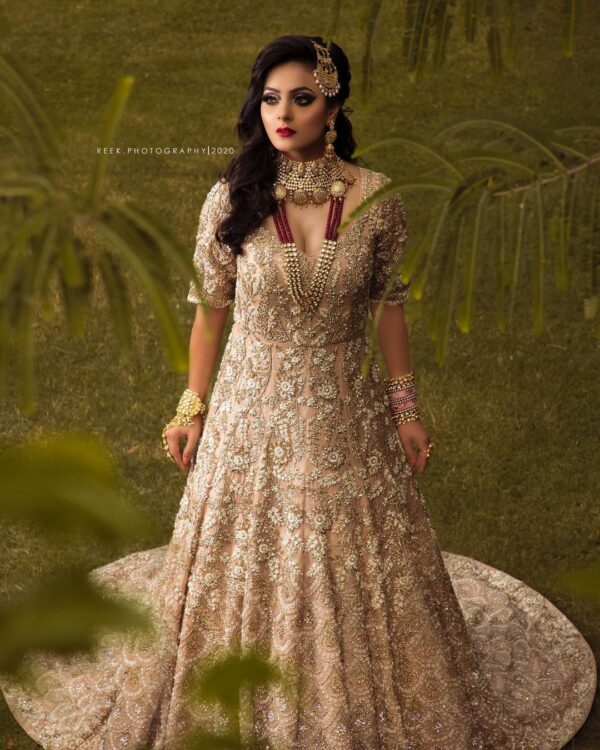 golden bridal gown with long trail