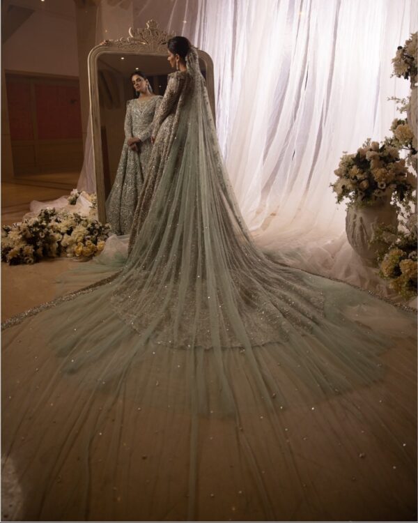 long trail wedding gown with hand work