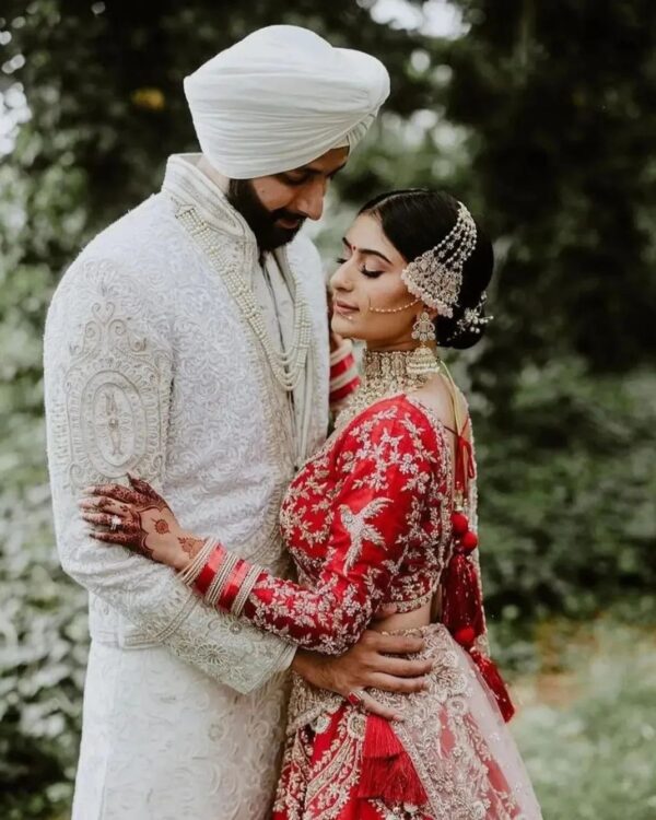 red bridal lehenga with hand work