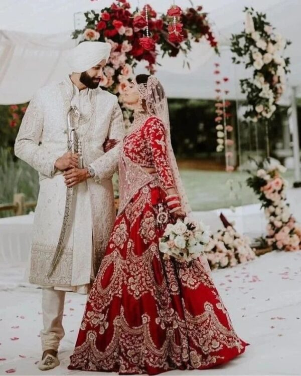 red bridal lehenga choli with hand work