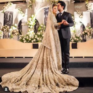 Golden long trail wedding gown with embroidery