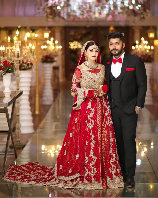 red long trail lehenga with handwork