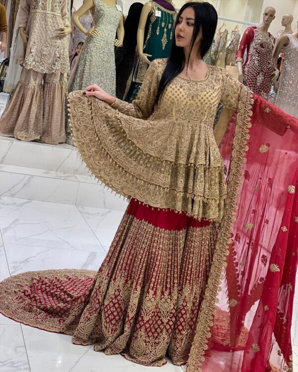 embroidered golden peplum with long trail lehenga