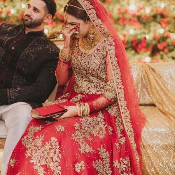 red long trail wedding gown with hand work
