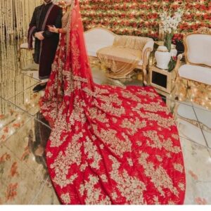 Red long trail wedding gown with golden embroidery