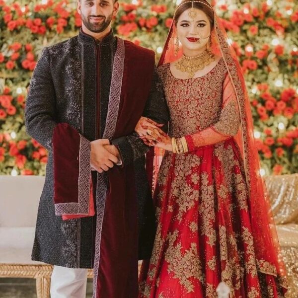 red long trail pakistani gown with golden embroidery