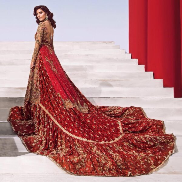 red designer bridal long trail lehenga with kameez