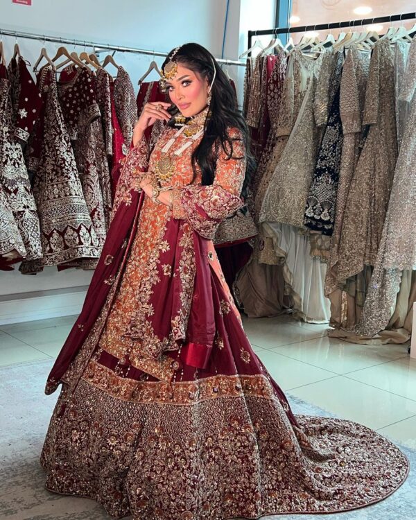 red embroidered kurti with long trail lehenga