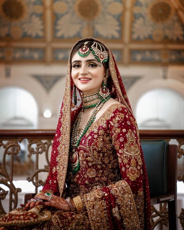 red bridal long trail lehenga with kurti