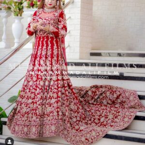 red long trail gown with golden embroidery