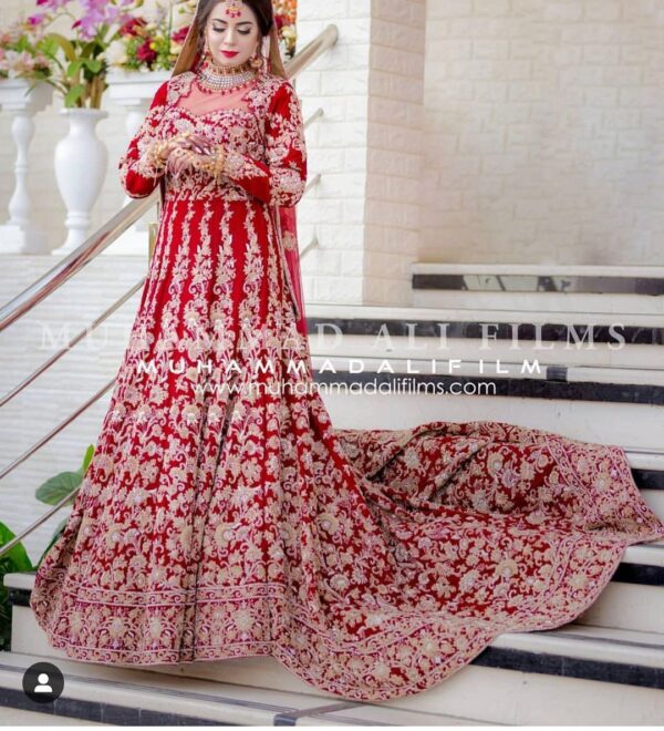 red long trail gown with golden embroidery