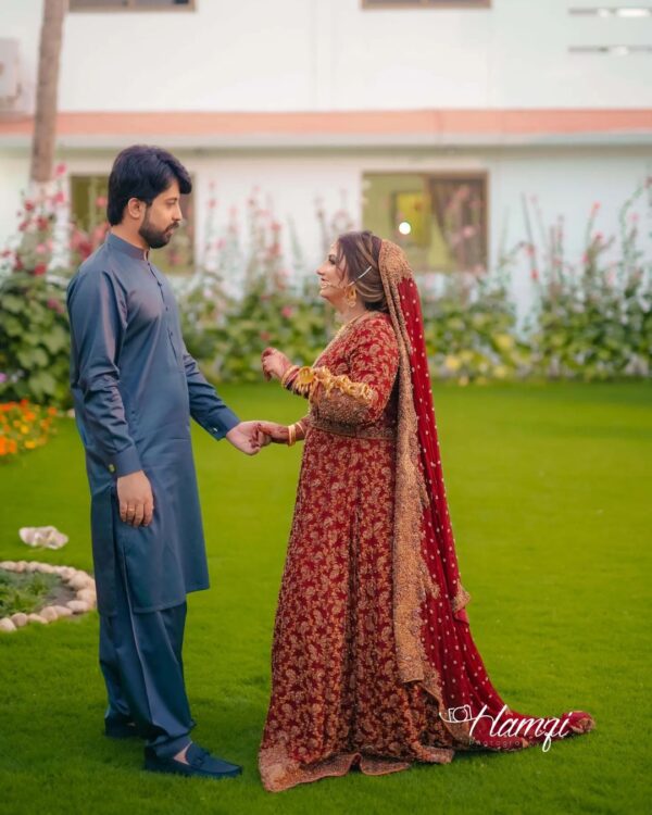 red bridal long trail gown with golden embroidery