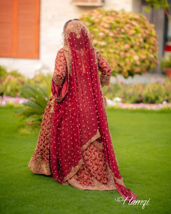 red bridal gown with golden embroidery