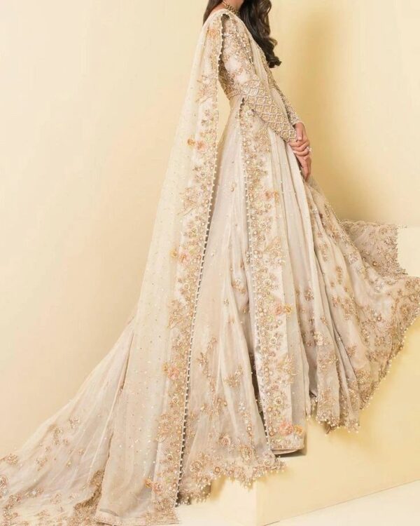 designer white and golden walima gown with embroidery