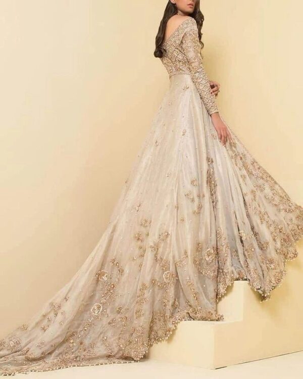 designer white and golden bridal gown with embroidery