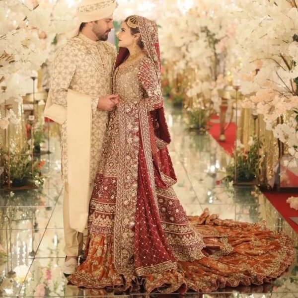 red and golden wedding long trail lehenga with kurti