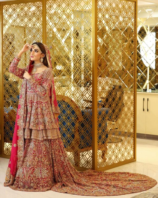 Red bridal peplum with long trail lehenga